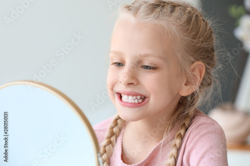 Little girl checking whiten...