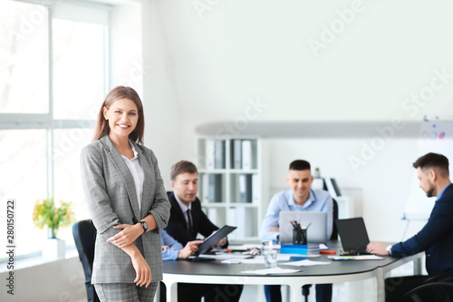 Businesswoman with colleagu...
