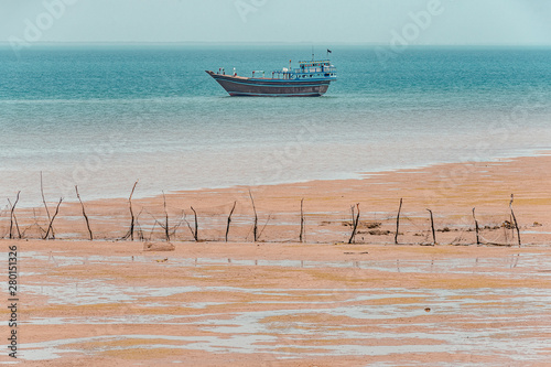 10/05/2019 Hormuz Island.Hormozgan Province.Iran, traditional fishing boats in the water of the Persian Gulf, photo taken from the ferry boat sailing on the island photo