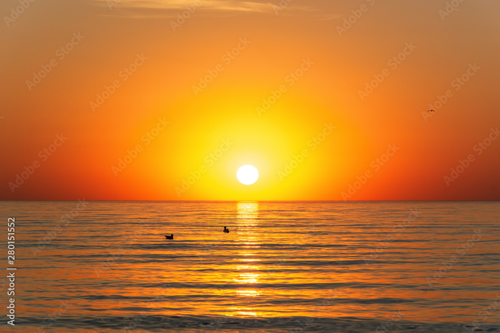 summer time orange sunset on seaside