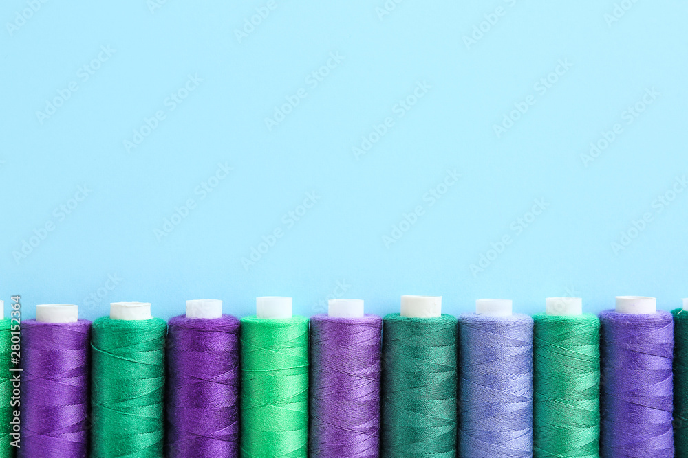 Many sewing threads on color background Many sewing threads on color background