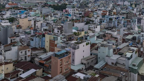 Time Lapse of dramatic changing light effect over terrace houses, rooftops and narrow alleyways of Binh Thanh (Bình Thạnh) District of Ho Chi Minh City (Saigon) Vietnam. photo