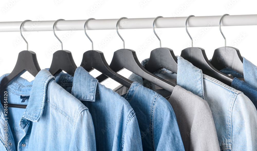 Fototapeta premium Rack with hanging clothes on white background
