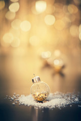 Christmas decoration on abstract gold background, close up