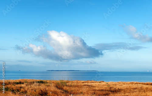 Fototapeta Naklejka Na Ścianę i Meble -  Lonely cloud on Aix island in charente Maritime coast