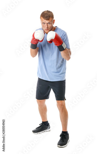Strong male boxer on white ...