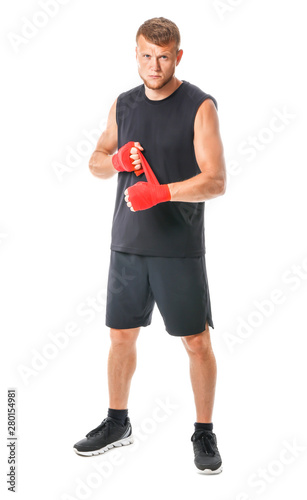 Strong male boxer on white ...