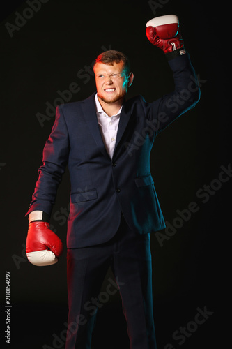 Businessman in boxing glove...