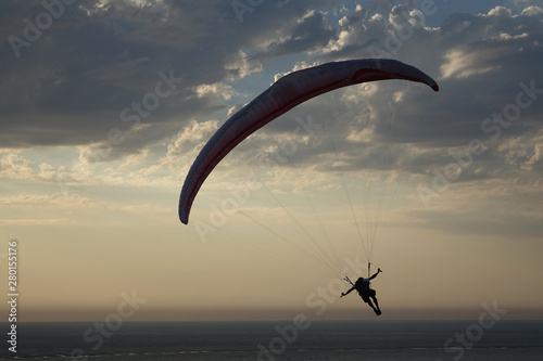 France. Paragliding in the evening from the Dunes of Pilat at the Atlantic Ocean