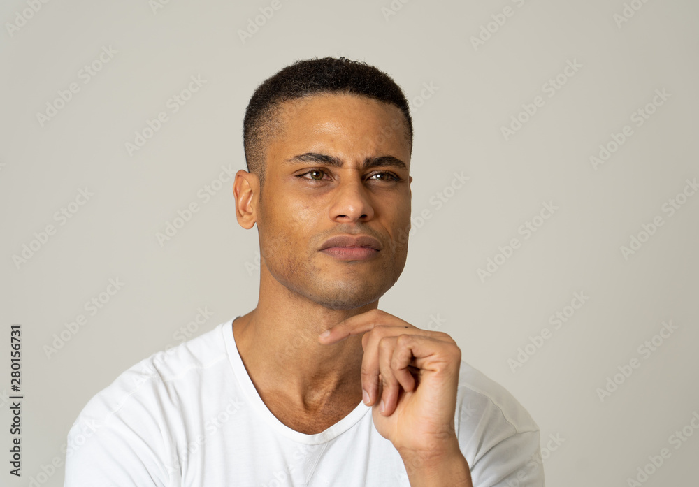 Young attractive african american man thinking in new ideas and planing future Young attractive african american man thinking in new ideas and planing future