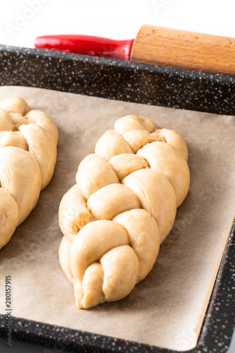 Homemade food concept process proved bread braid challah dough on white background with copy space photo