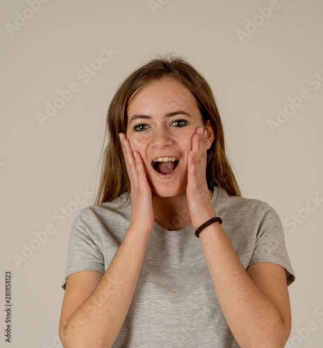 Close up portrait of surprised and happy teenager girl. In facial expressions