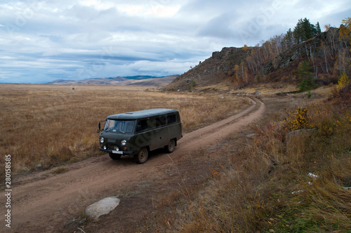 Barguzin Valley Russia, Russian off-road van on remote valley road © KarinD