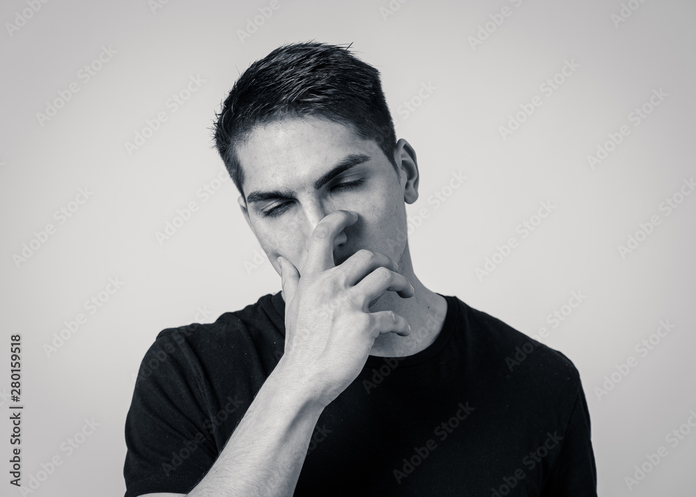 Portrait of sad and depressed young man feeling upset. Human expressions and negative emotions Portrait of sad and depressed young man feeling upset. Human expressions and negative emotions