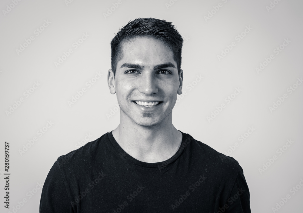 Portrait of attractive cheerful young man with smiling happy face. Human expressions and emotions Portrait of attractive cheerful young man with smiling happy face. Human expressions and emotions