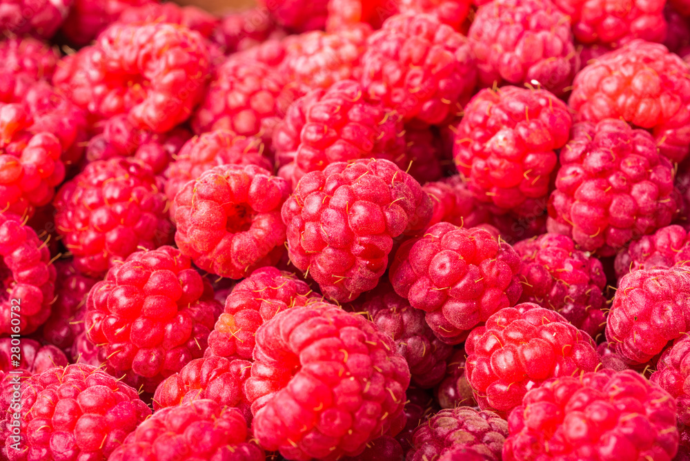 Red ripe strawberry berries closeup. Macro photo of raspberry, red berry background Red ripe strawberry berries closeup. Macro photo of raspberry, red berry background