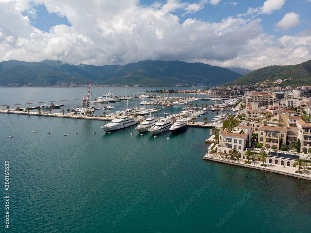 Aerial view of Porto Montenegro. Yachts in the sea port of Tivat city. Kotor bay, Adriatic sea. Famous travel destination. Aerial view of Porto Montenegro. Yachts in the sea port of Tivat city. Kotor bay, Adriatic sea. Famous travel destination.
