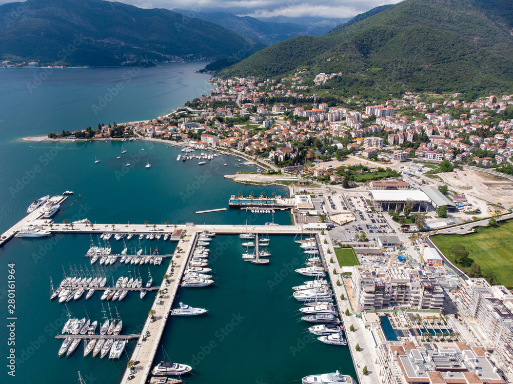 Aerial view of Porto Montenegro. Yachts in the sea port of Tivat city. Kotor bay, Adriatic sea. Famous travel destination.