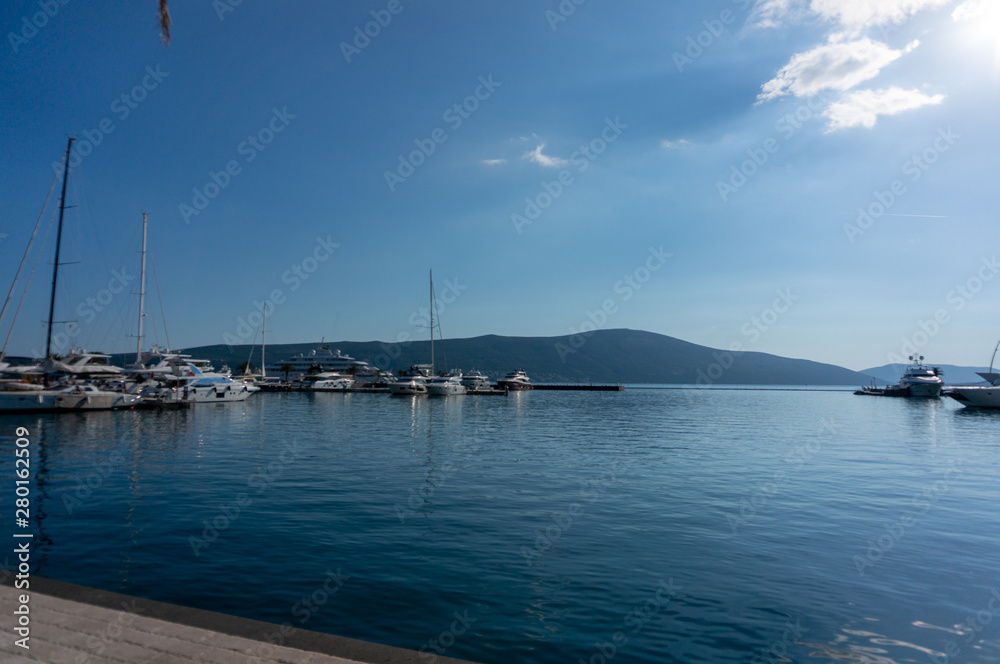 Porto Montenegro. Yachts in the sea port of Tivat city. Kotor bay, Adriatic sea. Famous travel destination. Porto Montenegro. Yachts in the sea port of Tivat city. Kotor bay, Adriatic sea. Famous travel destination.