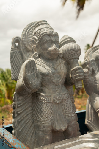 Beautifully carved statue of Hindu god Hanuman or Maruti rock sculpture at hampi for selling. photo