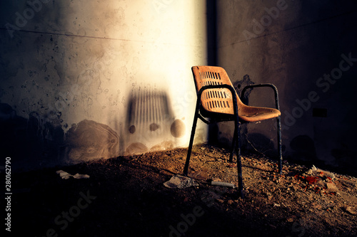 Spooky chair at the lost place Argentiera, in Sardinia (Italy)
