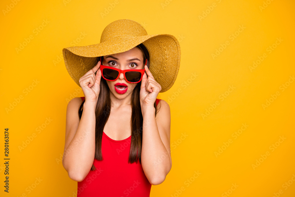 Photo of amazing lady bright lipstick nice colorful look came seaside trip voyage staring cold water ocean oh no wear specs sun hat red swimming suit isolated yellow background - obrazy, fototapety, plakaty 