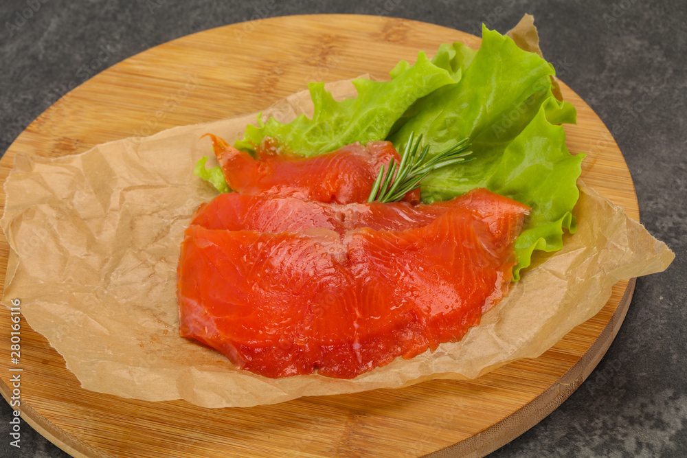 Sliced salmon fillet served rosemary Sliced salmon fillet served rosemary