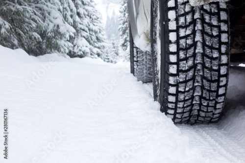Winter Tire on snow covered road. © Popa