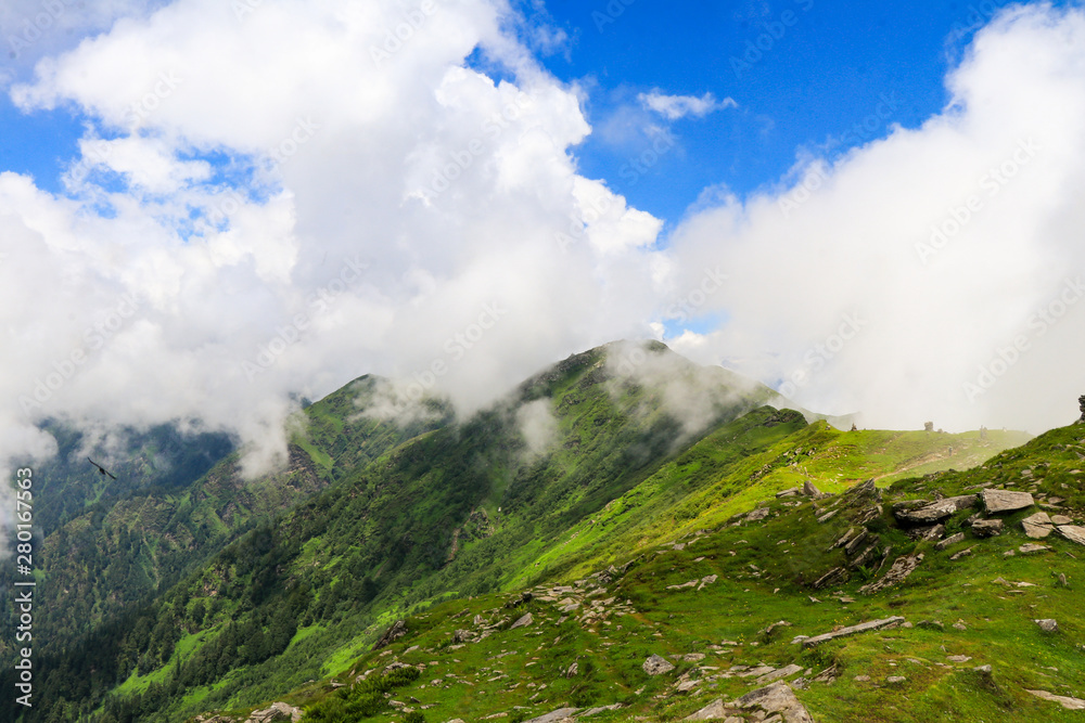 Man walks in clouds at 12000 ft from the sea level(right) at Chanderkhani Pass, India