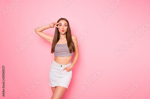 Portrait of her she nice-looking lovely girlish charming cute pretty cheerful cheery funny straight-haired lady showing v-sign near eye sending kiss posing isolated over pink pastel background