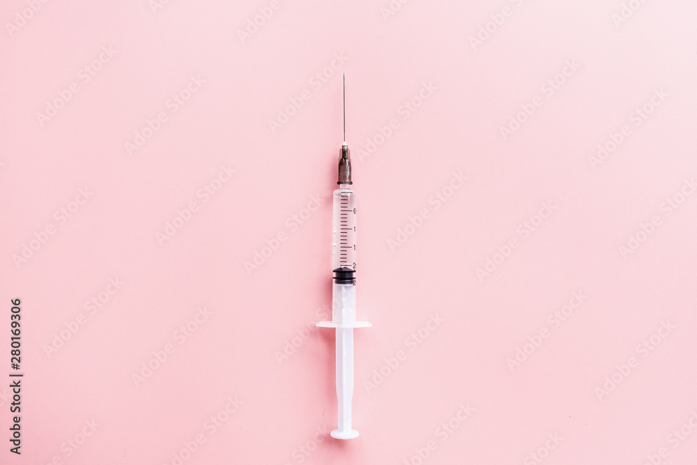Medical syringe on pink background, health and vaccination concept. Flat lay, mockup, overhead, top view and copy space. Medical syringe on pink background, health and vaccination concept. Flat lay, mockup, overhead, top view and copy space.