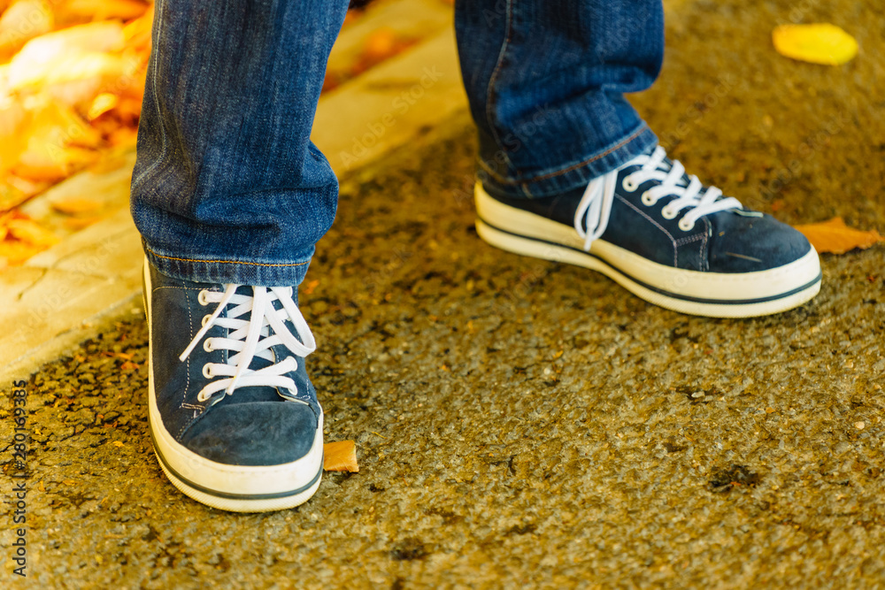 Person wearing casual sneakers outdoor