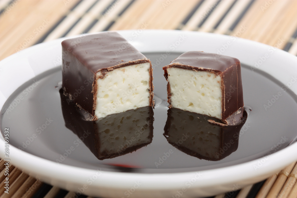 soft chocolate-covered candy filled with milk souffle