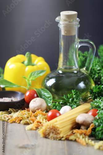 Spaghetti ingredients on wooden, Italian food background.