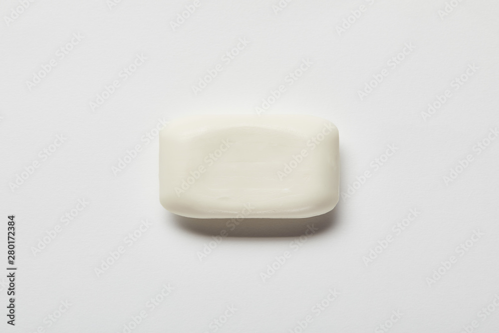 top view of white soap on grey background with copy space top view of white soap on grey background with copy space