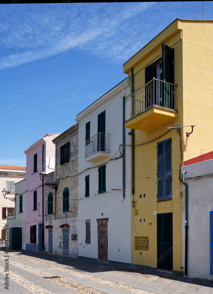 Row of colourful houses along the promenade in Alghero in Sardinia