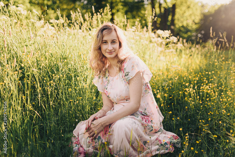 pregnant woman in summer city park