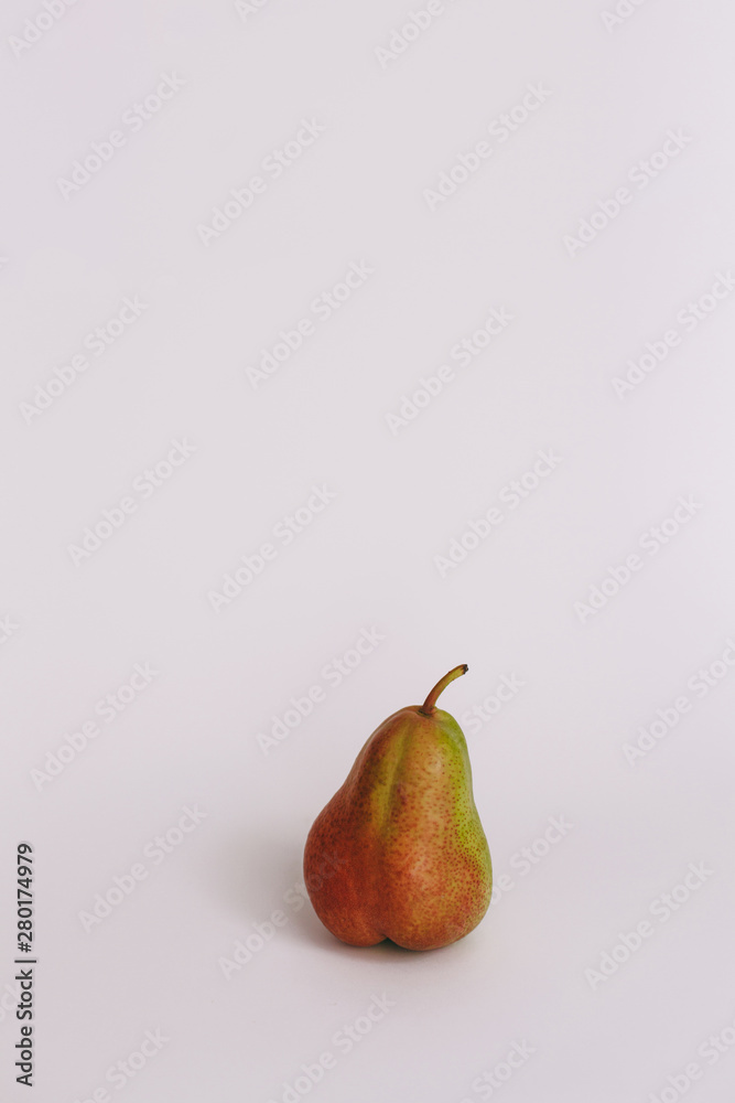 Sweet ripe fresh green pear with water drops, green leaves, spotted on white wood table. Sweet ripe fresh green pear with water drops, green leaves, spotted on white wood table.
