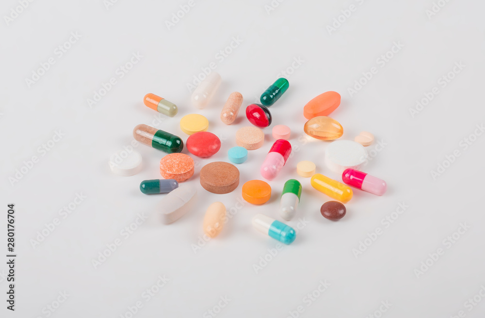 High number of pills on white background surface. High resolution image for pharmaceutical industry. High number of pills on white background surface. High resolution image for pharmaceutical industry.