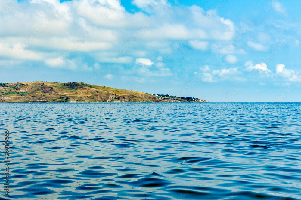 Landscape from the shore in the background against the blue sea Landscape from the shore in the background against the blue sea