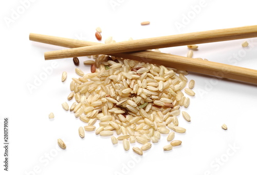 Integral rice pile with chopsticks isolated on white background