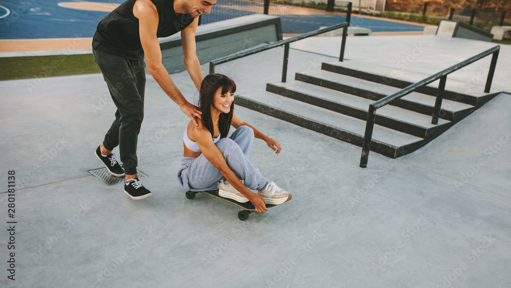 Young friends having fun at skate park