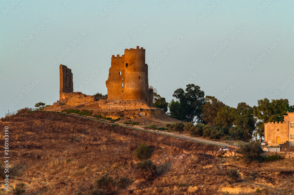 Fototapeta premium View of Mazzarino Medieval Castle with the Lights of Sunset, Caltanissetta, Sicily, Italy, Europe