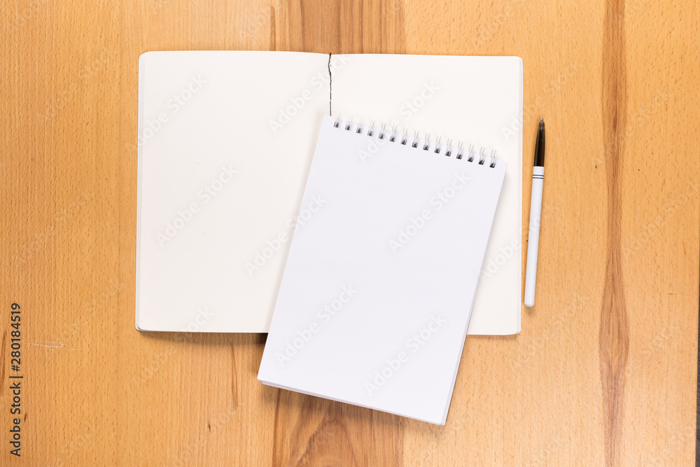 school notepad and pen on the wooden desk. spiral notepad on a tableschool notepad and pen on the wooden desk. spiral notepad on a table school notepad and pen on the wooden desk. spiral notepad on a tableschool notepad and pen on the wooden desk. spiral notepad on a table
