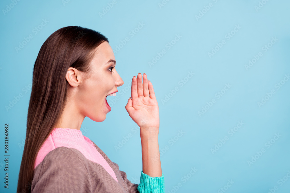 Half turned closeup photo of charming active excited cheerful teen lady making announcement holding hand near mouth isolated vivid background Half turned closeup photo of charming active excited cheerful teen lady making announcement holding hand near mouth isolated vivid background