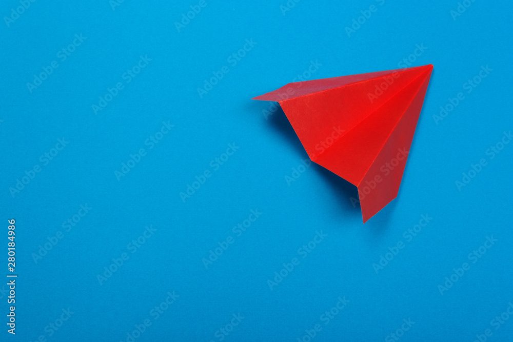 Red paper rockets or paper planes on a beautiful light blue background. Red paper rockets or paper planes on a beautiful light blue background.
