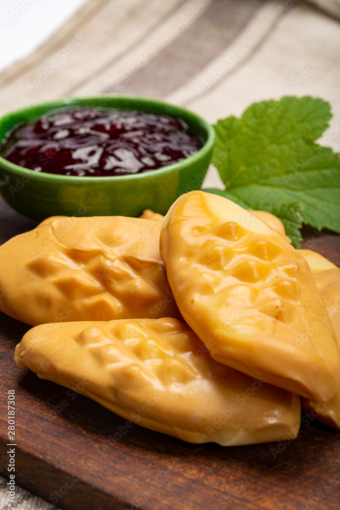 Oscypek or Oszczypek smoked cheese made of salted sheep milk exclusively in Tatra Mountains, Zakopane, Poland. Oscypek or Oszczypek smoked cheese made of salted sheep milk exclusively in Tatra Mountains, Zakopane, Poland.