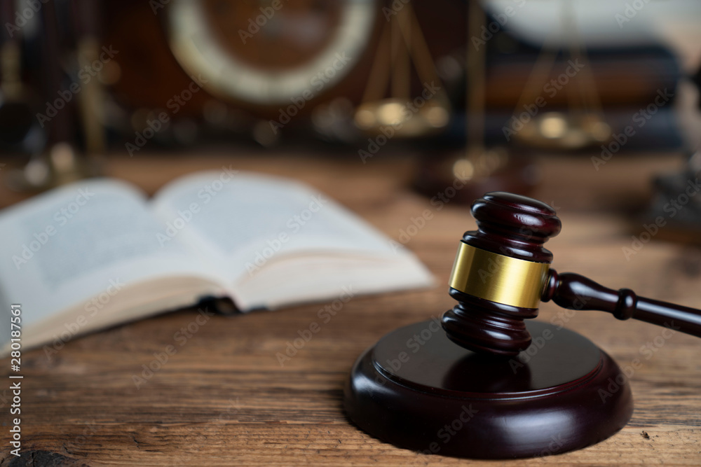The law concept background. Mallet of the judge and legal code The law concept background. Mallet of the judge and legal code