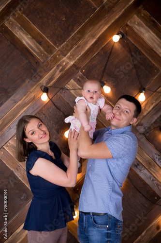 Happy Young Caucasian Family Posing in Studio © Samumneo