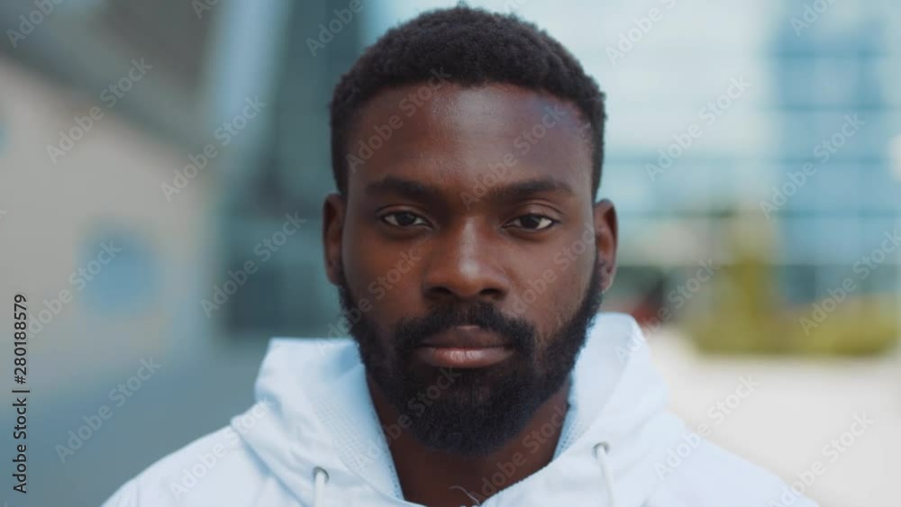 Portrait serious face african american man ooking at camera enjoying in urban city handsome confident lifestyle street urban attractive close up confidence outdoors close up slow motion. The best